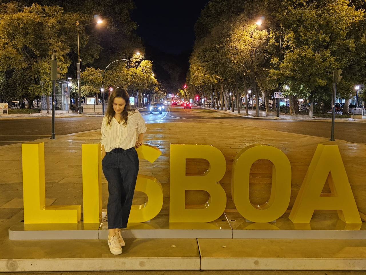 Me in front of a Lisboa sign